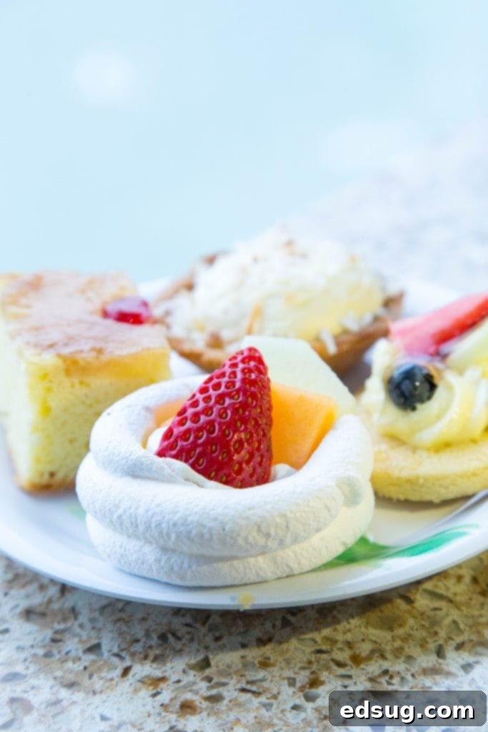 Easy Mini Pavlova Recipe 4 A selection of mini desserts from a cruise buffet, including a pavlova, showcasing the variety of treats available.