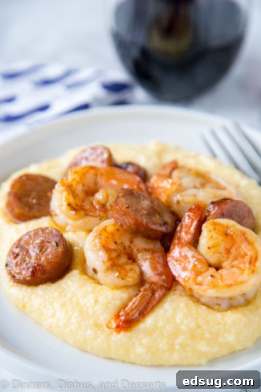 Simple Shrimp and Grits 2 A plate of food, with Grits and shrimp, ready to be enjoyed.