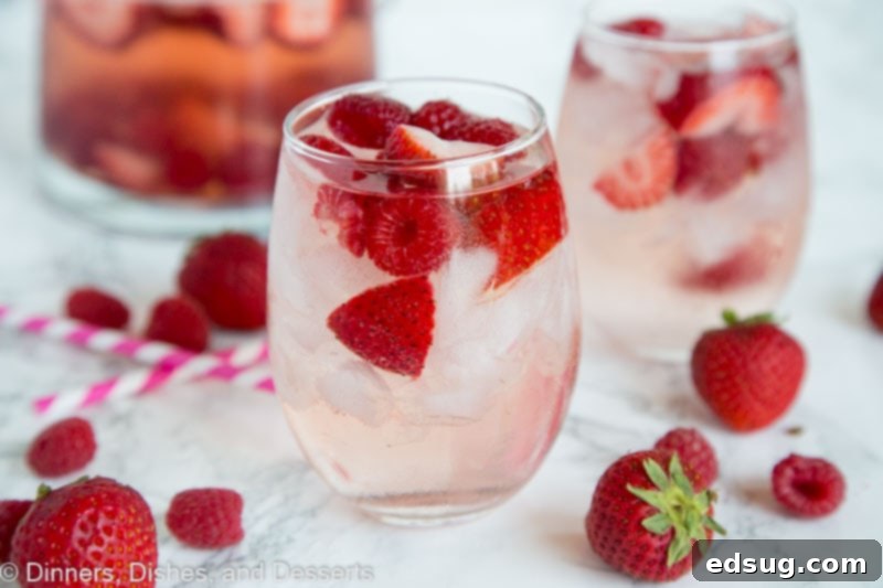 Blushing Berry Rose Sangria 3 A close up berry rose sangria in a glass