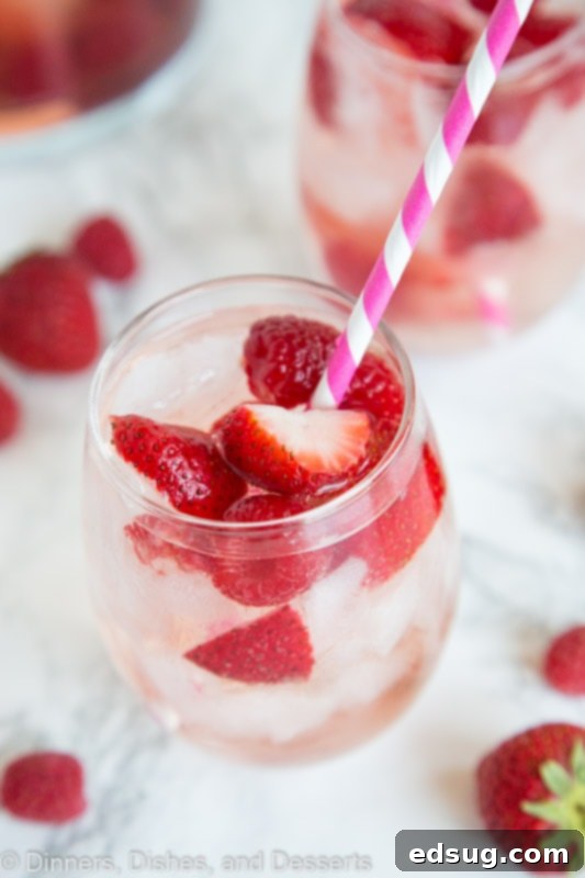 Blushing Berry Rose Sangria 4 A close up of a cup, with Sangria and Berry