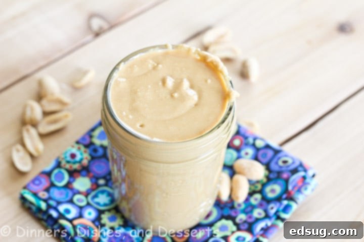 homemade peanut butter Freshly made creamy homemade peanut butter in a clear glass jar