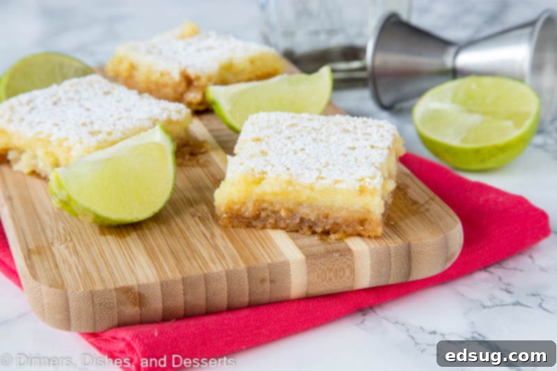 Zesty Lime Margarita Bars 3 sliced margarita bars on a cutting board