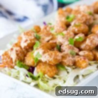 Bang Bang Shrimp Recipe - Crispy fried shrimp that is tossed in a sweet, spicy, and tangy sauce. The ultimate appetizer that will soon become your dinner! 