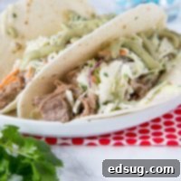 Instant Pot Pork Taco Perfection 6 Instant Pot Pork Tacos - these pulled pork tacos are super tender and so delicious. Topped with a creamy Mexican slaw and avocado sauce!