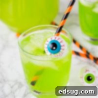 Hawaiian Punch Cocktail - Halloween cocktails are so much fun!  This starts with green Hawaiian punch, and has a version for adults and the kids!