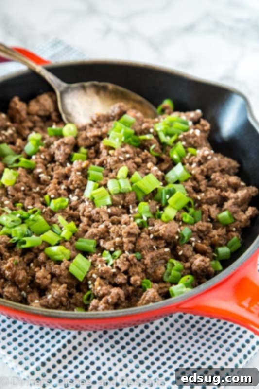 Quick Mongolian Ground Beef Stir-Fry 3 A skillet with mongolian ground beef topped with green onions