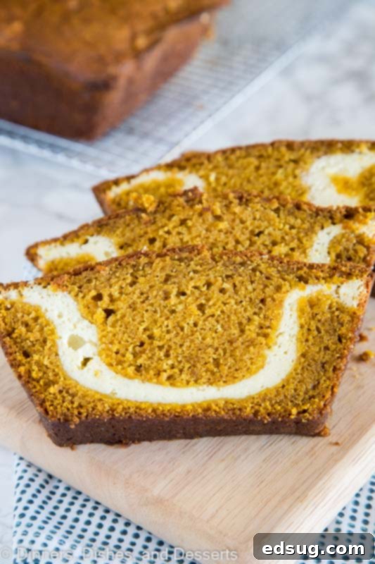 A slice of pumpkin bread with cream cheese swirl