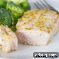 A close up of a plate of food with broccoli, with Pork