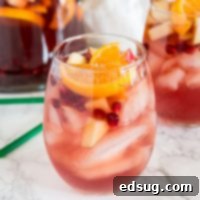 Festive Christmas Sangria 6 Christmas Sangria Recipe - This fun white wine sangria and all full of fall and winter flavors. It is perfect for Christmas and all your winter get togethers!