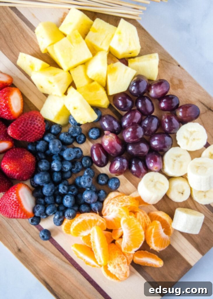 Colorful Fruit Skewers 3 looking down on cutting board full of fresh fruit