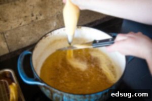 Sweet Homemade Churro Delights 16 cutting batter into hot oil