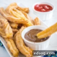 Sweet Homemade Churro Delights 9 close up of churros on a plate being dipped in chocolate