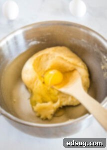 Sweet Homemade Churro Delights 10 first egg being added to batter