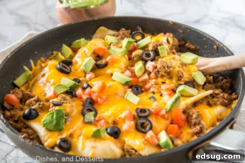 Loaded Pierogy Taco Skillet 5 A pan filled with food, with Taco and Pierogi