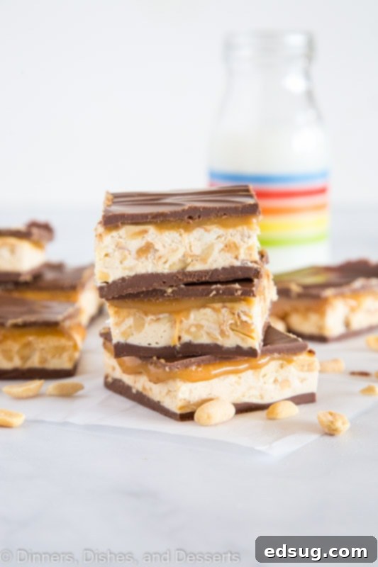 Decadent Chocolate Caramel Nougat Bars 2 chocolate bars stacked on a table