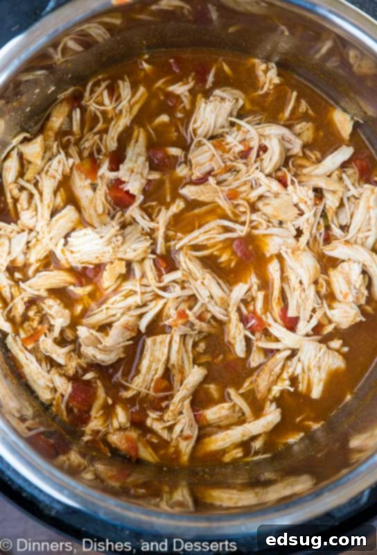 Quick Instant Pot Chicken Tacos 4 shredded chicken in a pot