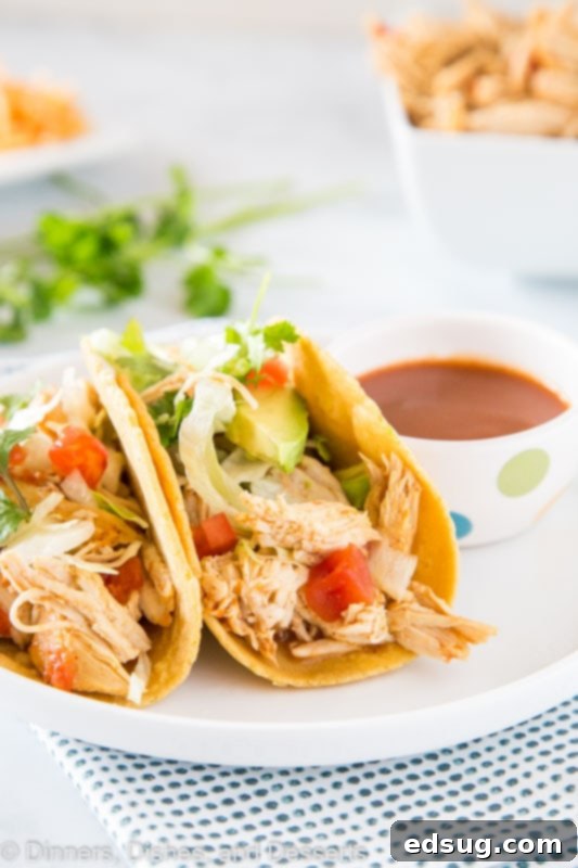 Quick Instant Pot Chicken Tacos 5 A plate of food on a table, with Taco and Chicken