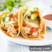 Quick Instant Pot Chicken Tacos 7 chicken tacos on a plate