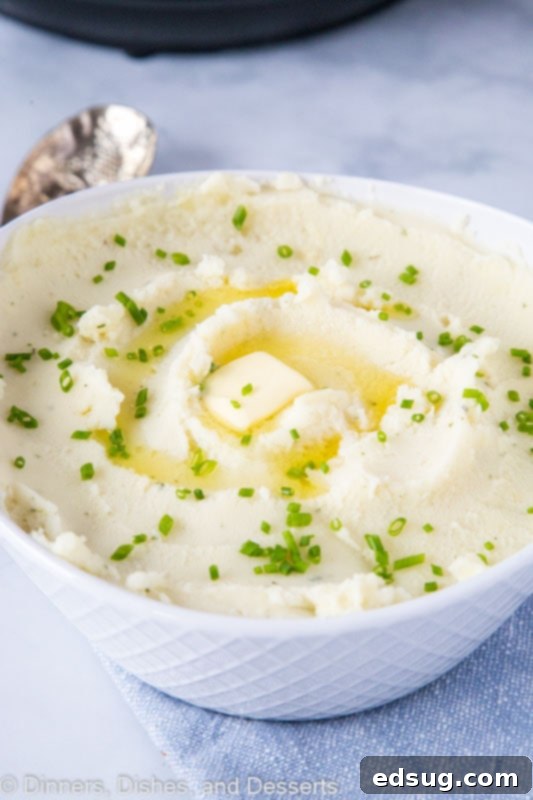 Creamy Instant Pot Mashed Potatoes 2 A bowl of potatoes with butter