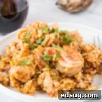A plate of food with rice meat and vegetables