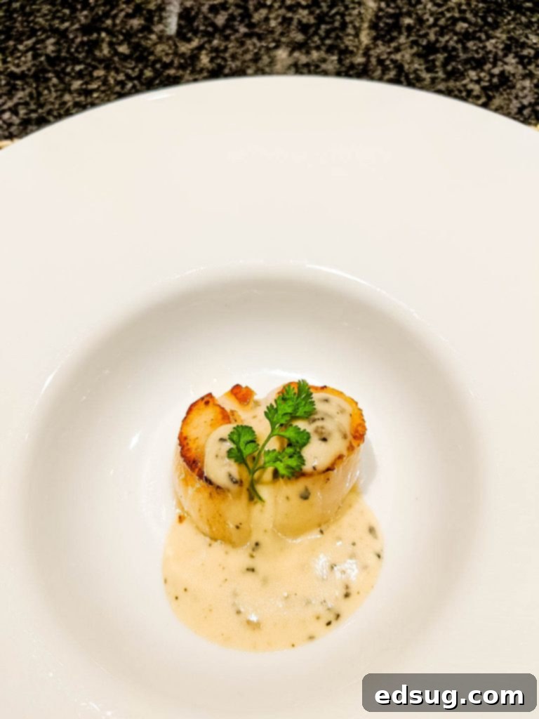 Japan's Legendary Wagyu 4 Gourmet scallop appetizer with rich truffle sauce at Ginza Steak