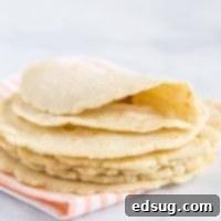 Homemade Corn Tortillas - Elevate your Mexican night with these incredibly easy, just 3-ingredient homemade tortillas. They're undeniably superior to any store-bought alternative, offering fresh flavor and a perfect texture every time.