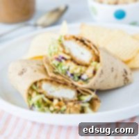 chicken wrap on a plate, sliced in half