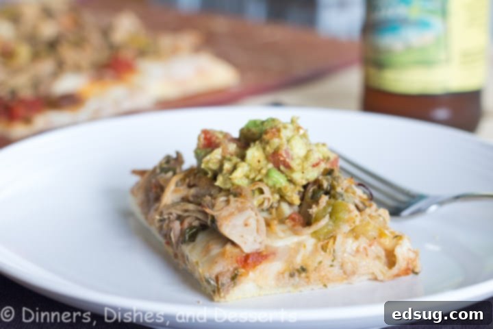 Carnita Pizza Ingredients Ingredients laid out for making Carnita Pizza, including pizza dough, shredded pork carnitas, salsa, cheese, and a bowl of guacamole.