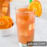 The Ultimate Beach Fling Cocktail 6 A close up of a glass of orange juice