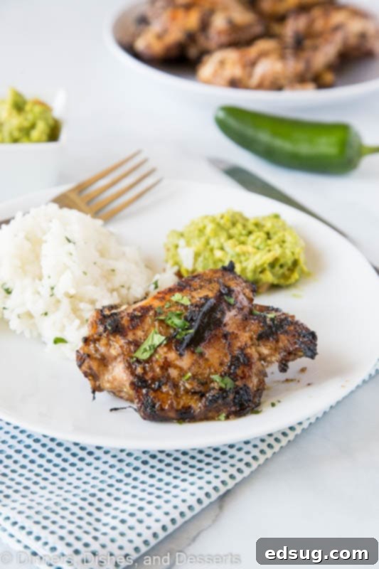 Fiery Jamaican Jerk Chicken 3 Jerk chicken recipe served with rice and guacamole for a full Caribbean meal