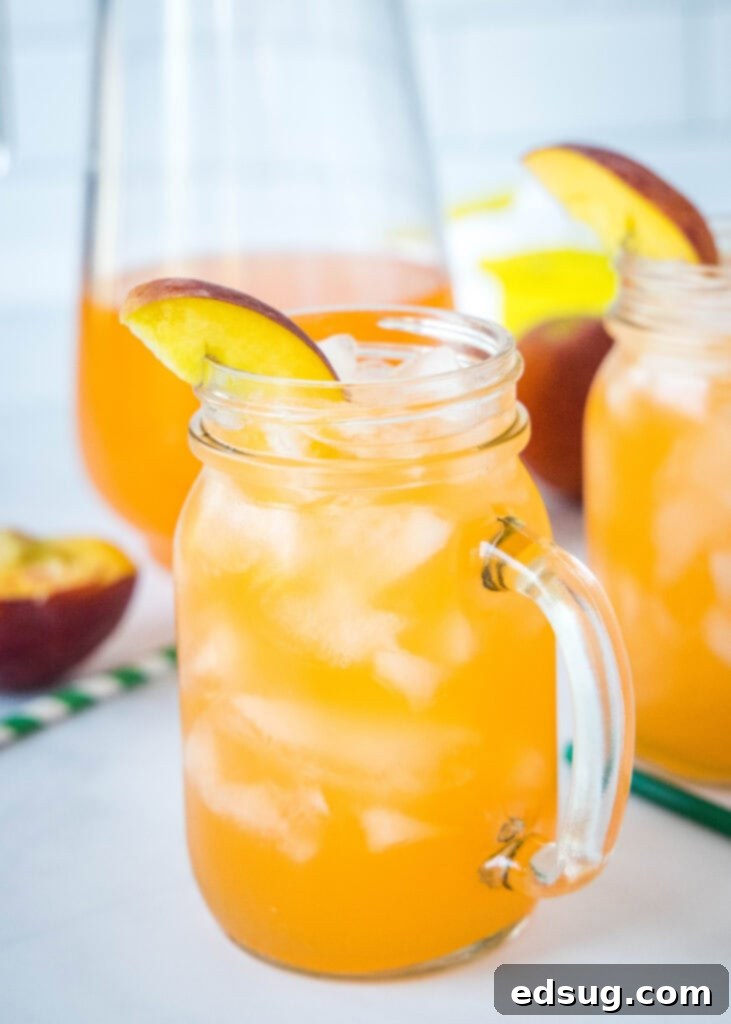 Golden Peach Zest 2 glass of homemade peach lemonade with ice