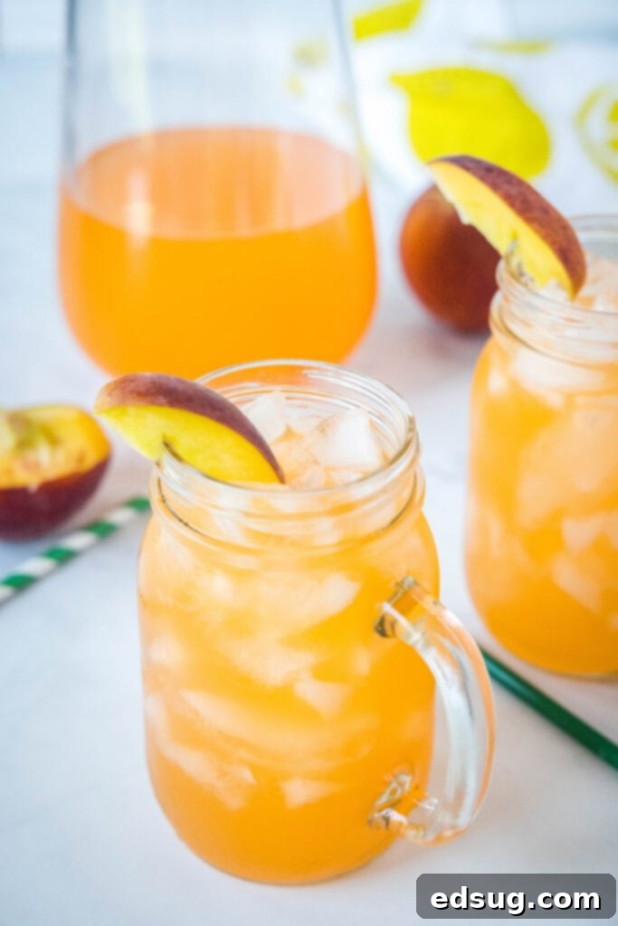 Golden Peach Zest 4 peach lemonade in glasses with ice on a table