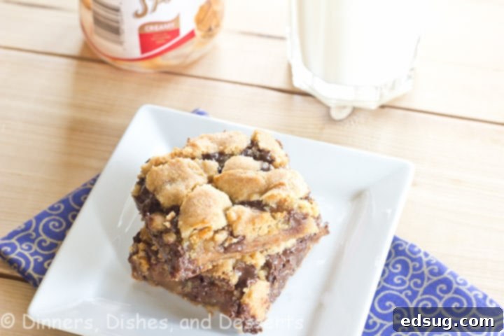 Close-up of a stack of Biscoff Caramel Chocolate Chip Cookie Bars