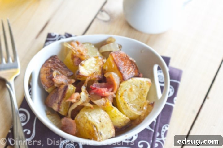 roasted potato salad with caramelized onions and bacon in a bowl