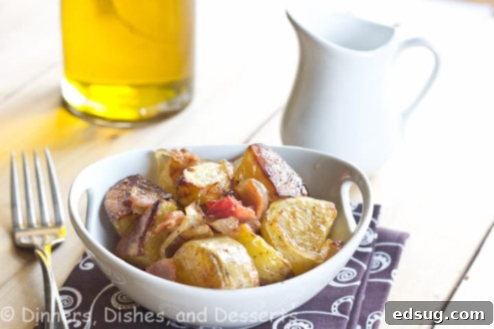 roasted potato salad with caramelized onions and bacon in a bowl