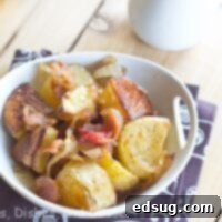 roasted potato salad with caramelized onions and bacon in a bowl