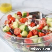 A bowl of fresh Greek salad with vegetables and feta cheese