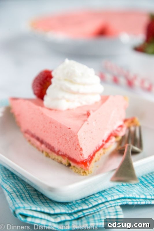 Easy no bake jello pie using strawberry jello. Topped with whipped cream and strawberries
