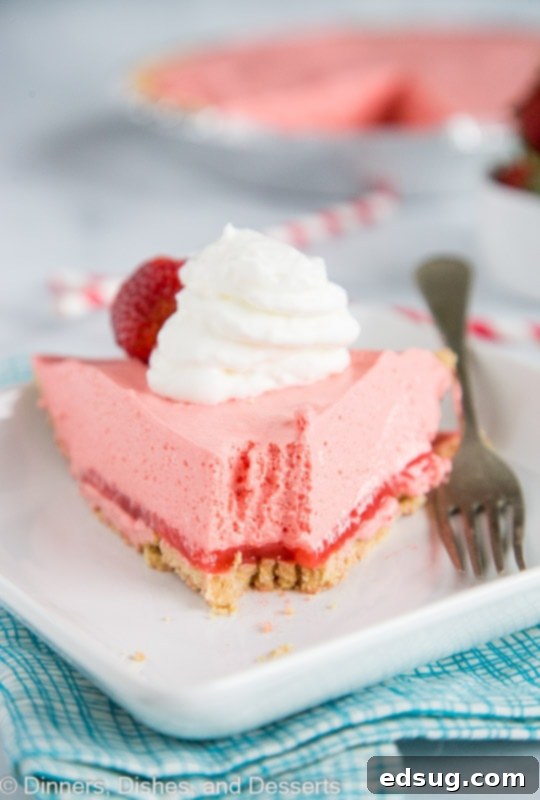 No bake pie with strawberry jello, cool whip, and a graham cracker crust