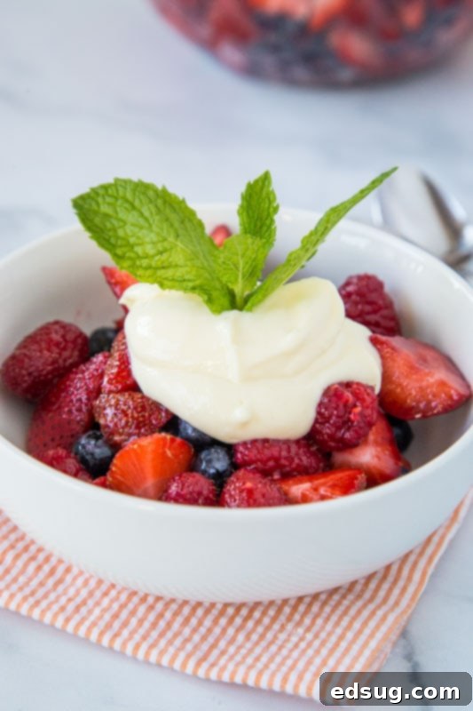 Fresh Berry Medley 2 Easy fruit salad recipe featuring fresh strawberries, blueberries, and raspberries, elegantly topped with a tangy lemon yogurt dressing.