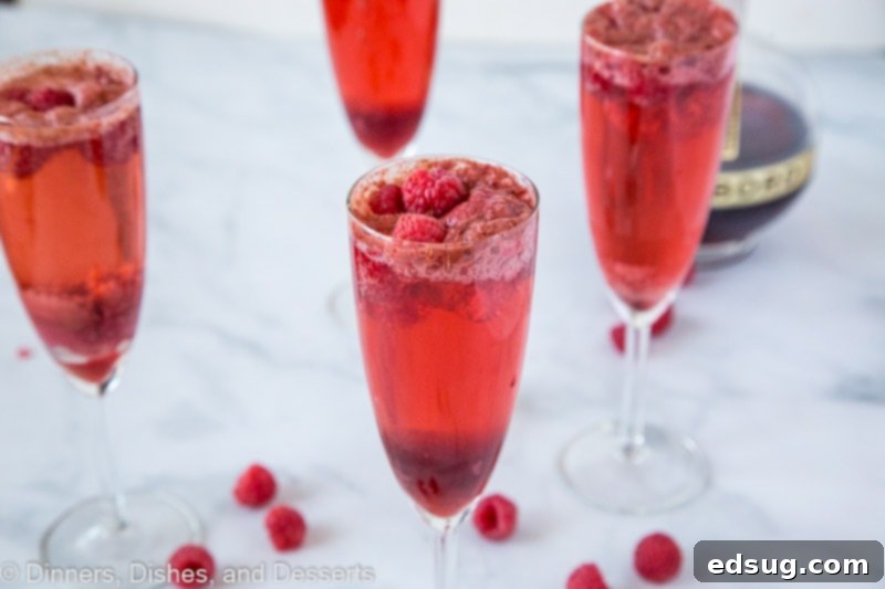 A glass of wine, with Raspberry and Mimosa