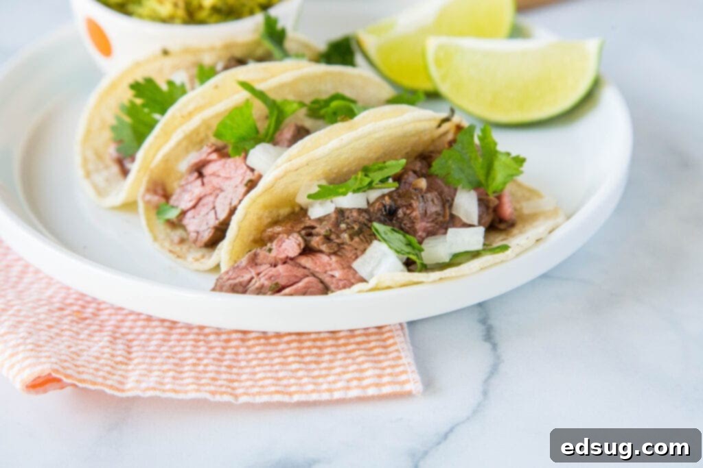 Zesty Flank Steak Tacos 4 Tacos with flank steak marinated in lime juice, olive oil, garlic and cilantro