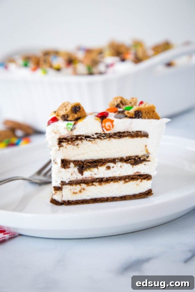 Ice cream sandwich cake with fresh whipped cream and topped like an ice cream sundae, ready to be served