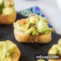Avocado bruschetta on a serving platter, ready to be enjoyed.