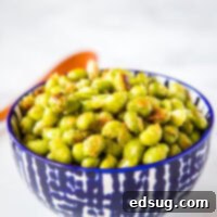 Crispy Garlic Parmesan Edamame 6 A bowl of food edamame