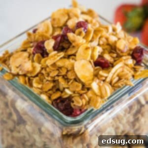 Classic Vanilla Granola 4 Cropped close-up of delicious vanilla almond granola in a glass jar, ready to be served