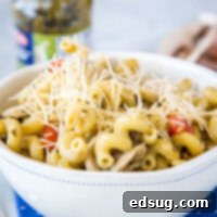 Signature Pesto Cavatappi 6 A bowl of pasta sits on a plate