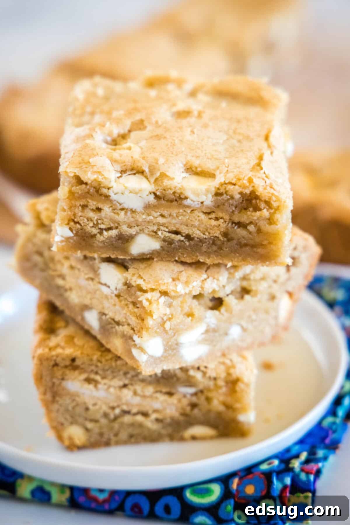 stacked golden oreo blondies on a white plate