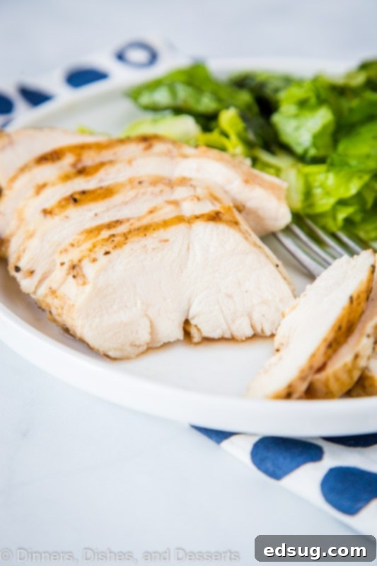 Ultimate Sous Vide Chicken Breast 4 Extremely tender and juicy sliced sous vide chicken breast, showcasing its perfect internal structure.