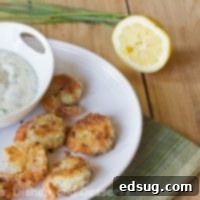 Golden Herb Shrimp with Zesty Chive Aioli 1 crispy herbed shrimp with chive aoli on a plate